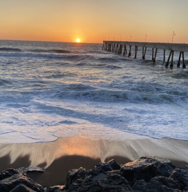 photograph of sunset behind Pacifica pier